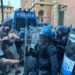 Lancio di bomba carta da manifestanti e carica della Polizia a Bologna